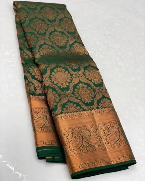 Intricate Dark Green Soft Silk Saree With Glorious Blouse Piece