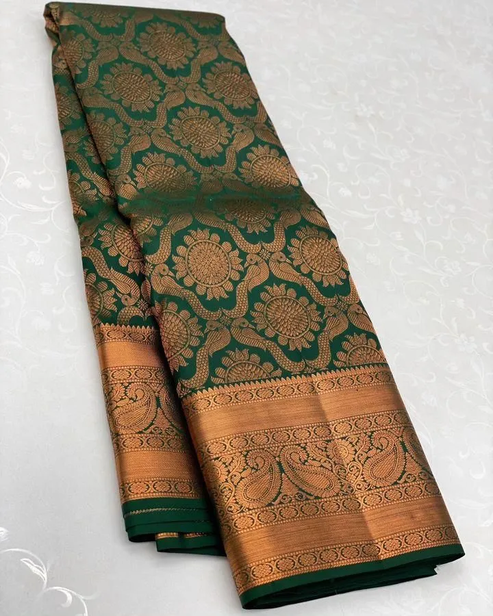 Intricate Dark Green Soft Silk Saree With Glorious Blouse Piece