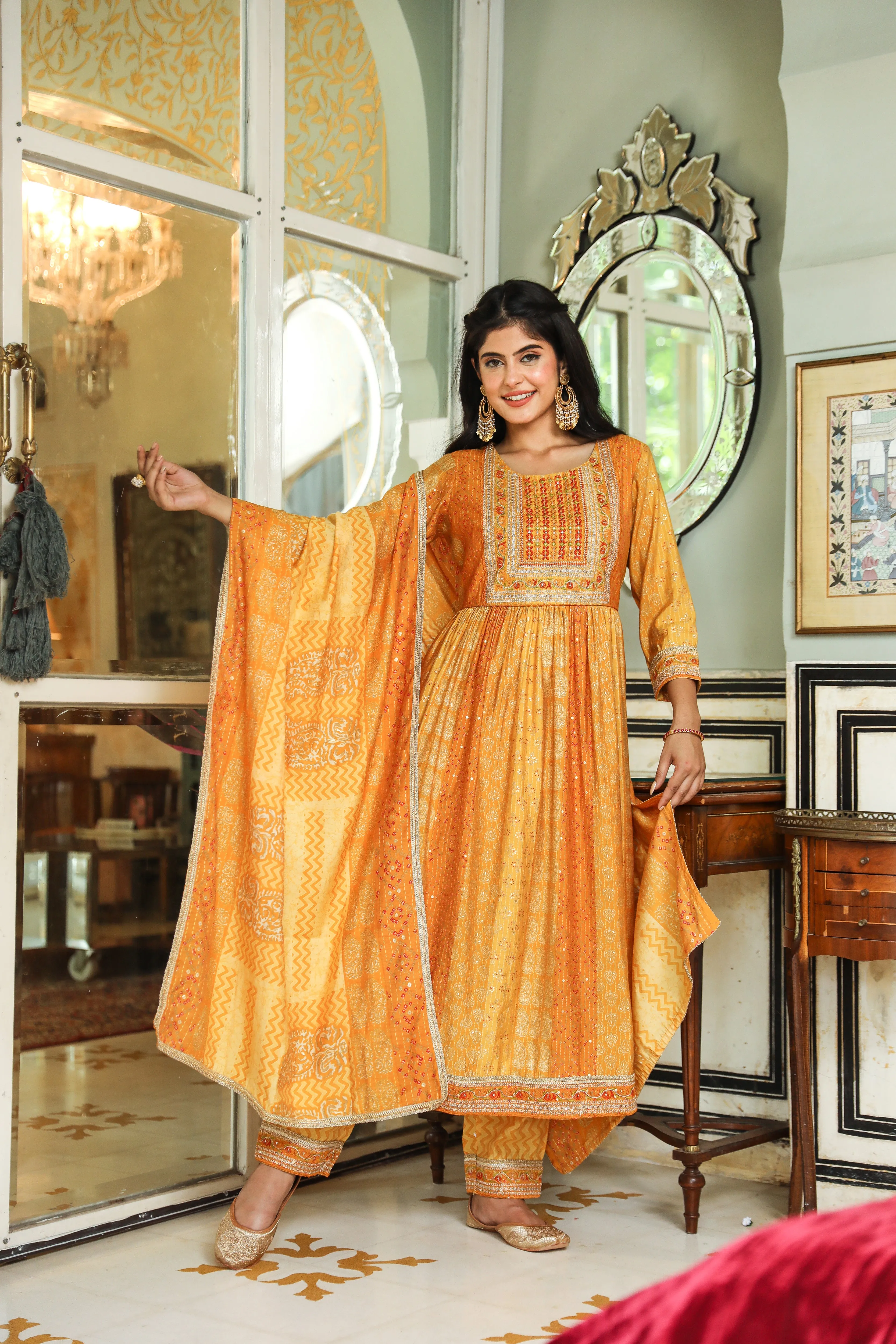 Women Mustard Muslin Nyara Cut A-Line Kurta Trouser Dupatta & Fancy Potli Set
