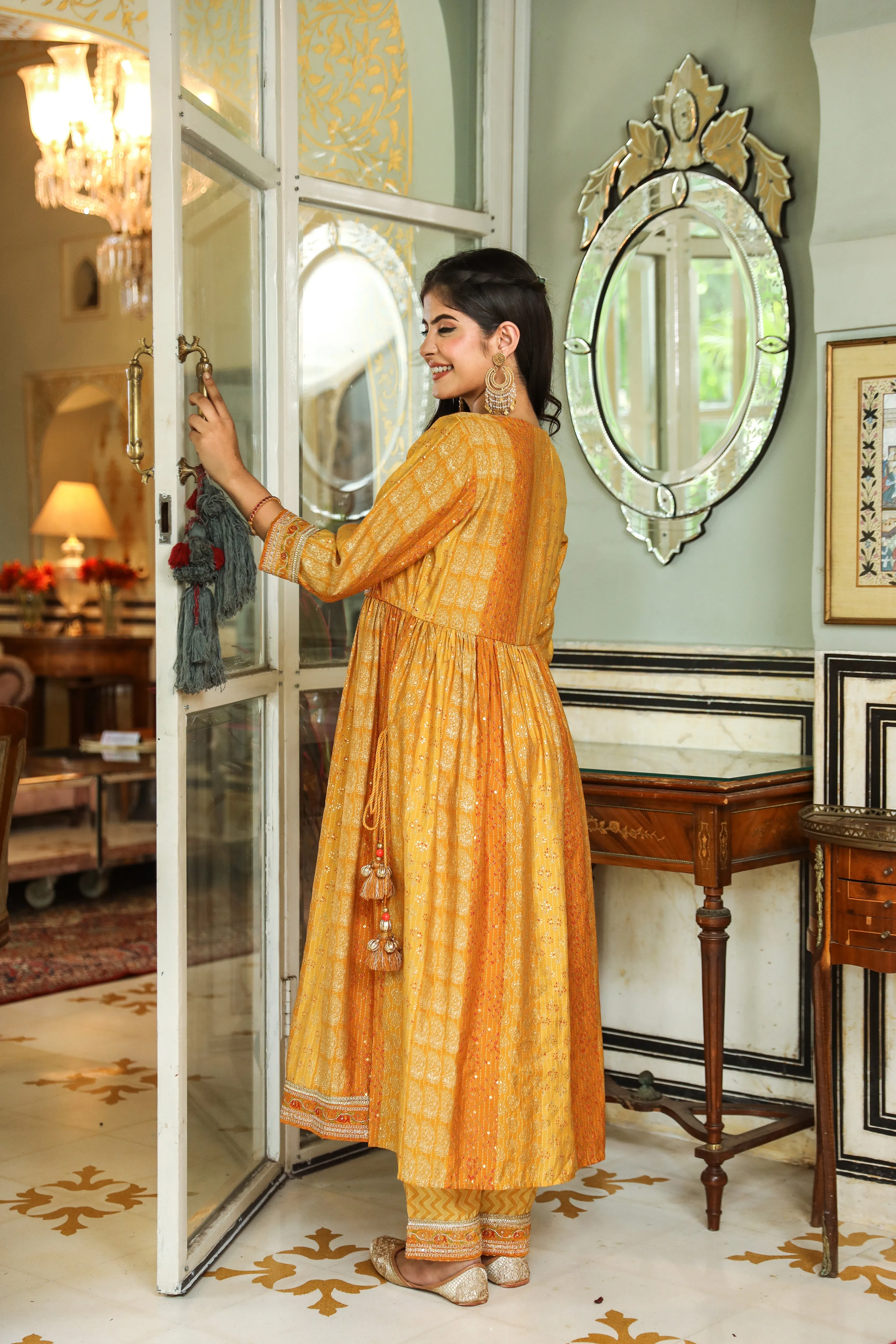 Women Mustard Muslin Nyara Cut A-Line Kurta Trouser Dupatta & Fancy Potli Set